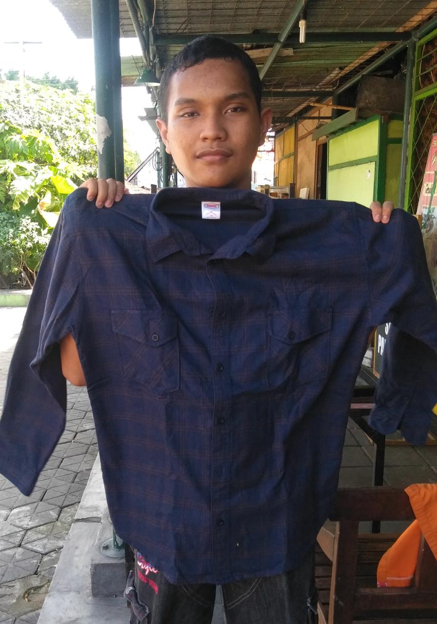 PENYALURAN DONASI KEMEJA
